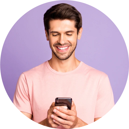 Man smiling with a message icon next to him. ZeroBounce has 99% ,[object Object], accuracy.