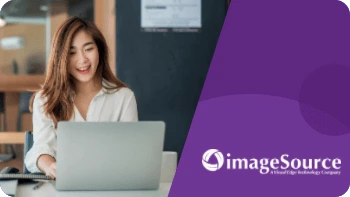 A woman from Image Source checks her laptop to see her reduced bounce rate from her case study.