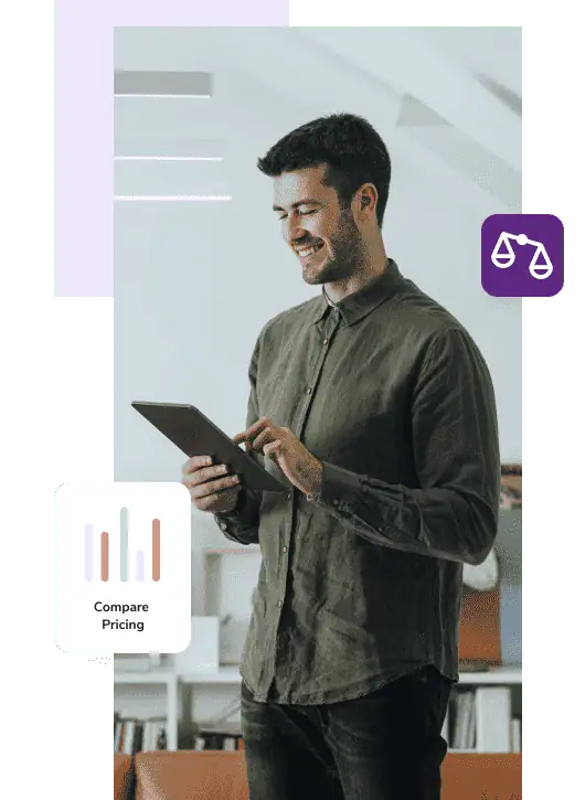 Standing man in green shirt and jeans comparing email validation pricing on a tablet