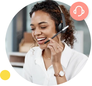 A woman in a white shirt talks to a customer using a hands-free headset.