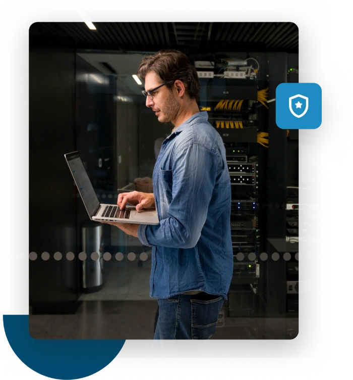 Man on laptop monitors his domain reputation with a free blacklist checker