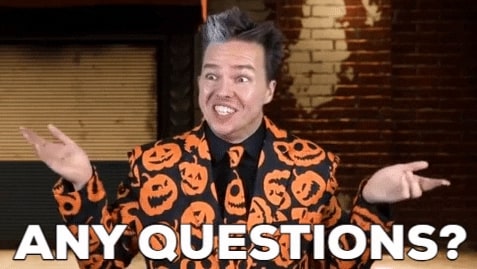 Eccentric man dressed as David Pumpkins with jack-o-lantern suit holds out hands to ask if anyone has a question on GIFs.