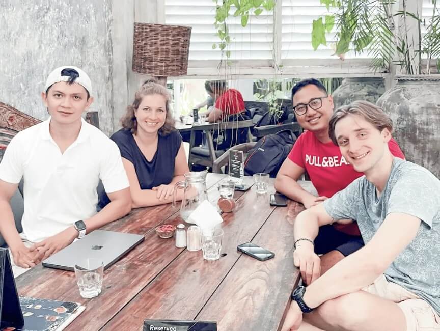 mailbird co-workers having lunch in bali discussing the best email tactics to boost email marketing results