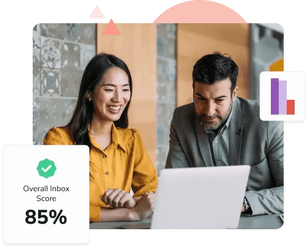 A woman in a yellow shirt looks at a laptop with her male coworker and sees an Overall Inbox Score of 85%.