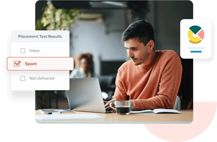 A man sitting at his desk looking at his inbox placement test results on his laptop, which indicate that his email went to spam.