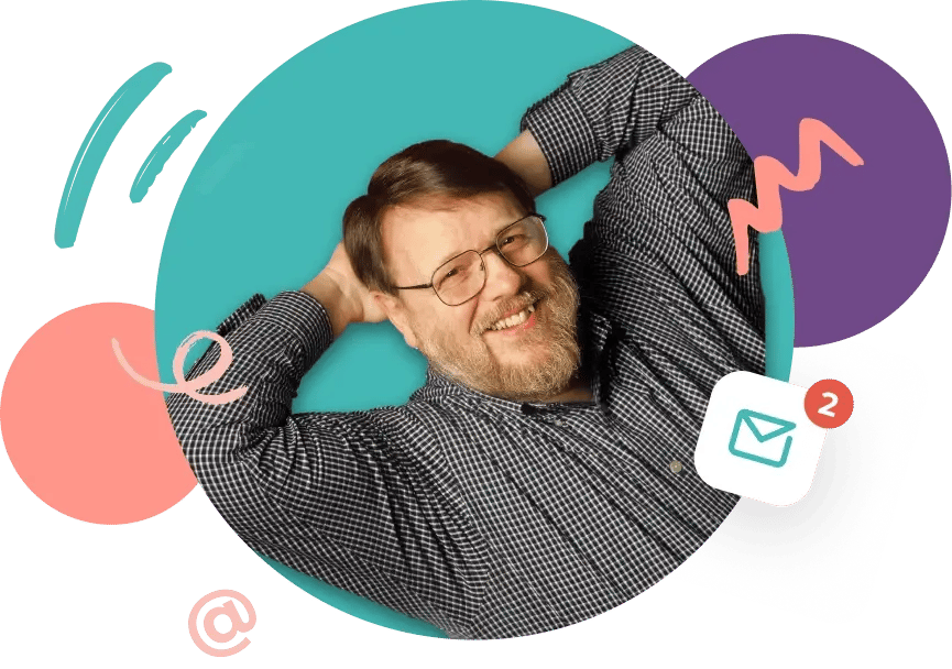 Computer engineer Ray Tomlinson, inventor of email, shown smiling and wearing glasses and a checkered shirt