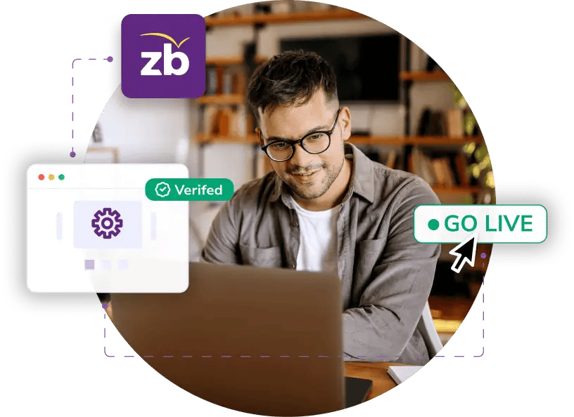 A man on a laptop using ZeroBounce to test and approve integration before going live.