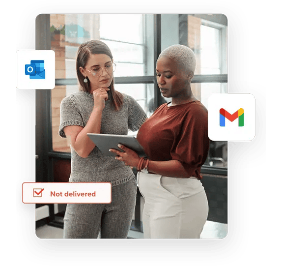 A woman in a grey outfit and glasses looks at a tablet held by a woman on her left wearing a red top and white pants alongside the Outlook logo, Gmail logo, and a "not delivered" notification.