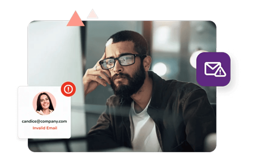 Un hombre barbudo con gafas mira pensativo mientras dice que 'candice@company' es una dirección de correo electrónico inválida.