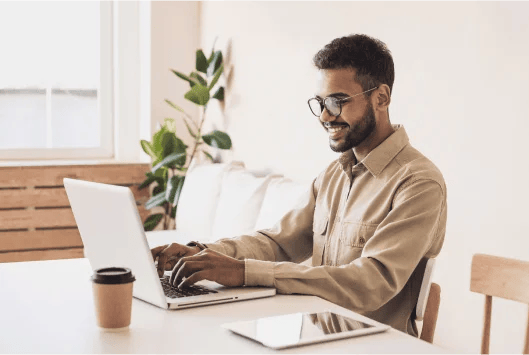 Man smiling as he successfully blocks disposable emails from his email list