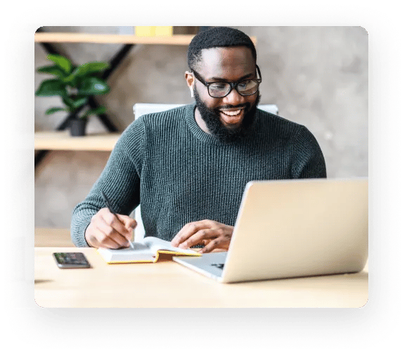 Man smiling as he uses the ZeroBounce email finder to connect with new people in his industry