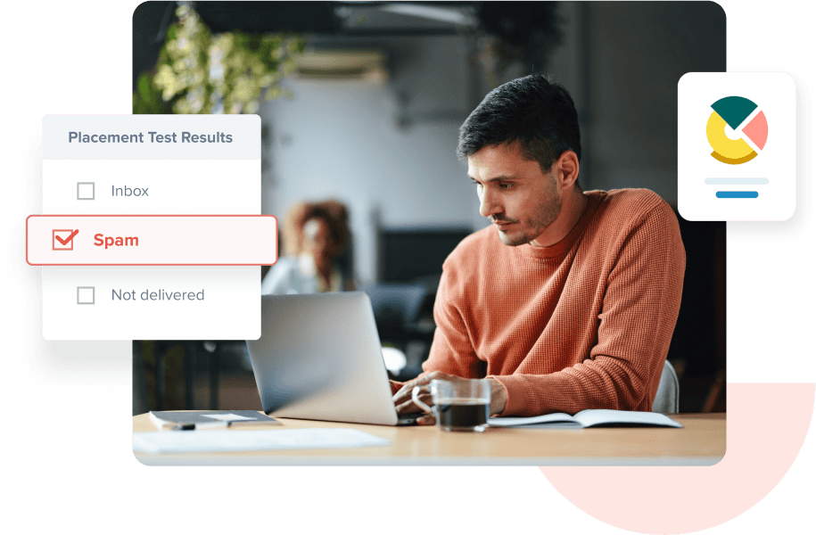 A man sitting at his desk looking at his inbox placement test results on his laptop, which indicate that his email went to spam.