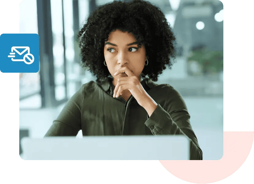 A woman holds her hand to her mouth and looks off to her right in thought.