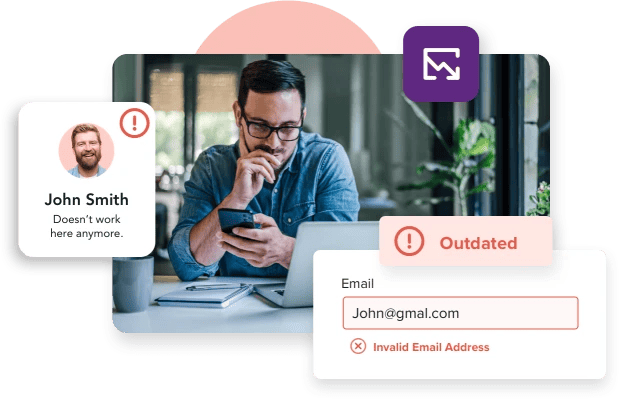 Man working from phone and laptop to learn why his email is bouncing