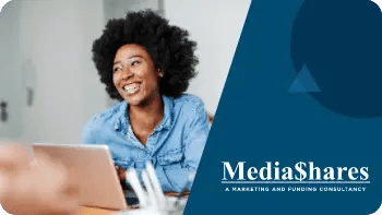 Woman from MediaShares smiling at the results of their ZeroBounce case study.