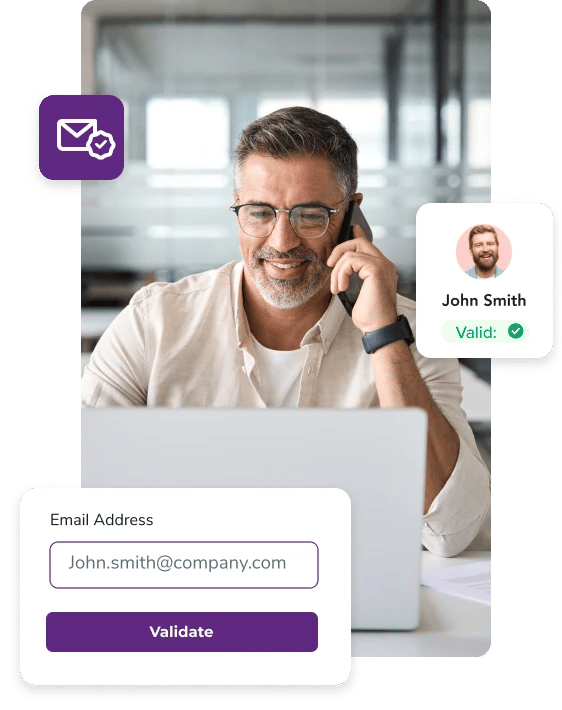 Man talking on his phone while scrubbing his email list on his laptop
