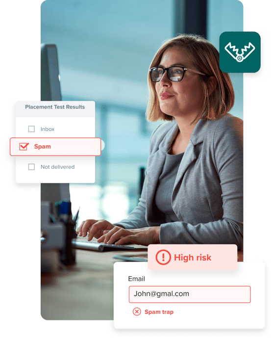 Woman working on her pc, surrounded by notifications that an email is a high-risk spam trap