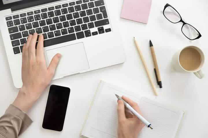 image of a person at a desk looking up email validation services. 