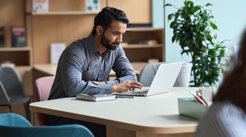 man working at laptop finding ways to aboid gmail bounces ahead of the great gmail purge