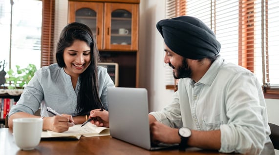 indian man and woman checking zerobounce india dpdp bill compliance in front of computer