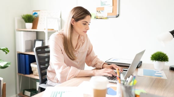 woman working on computer to improve email design for email marketing campaign