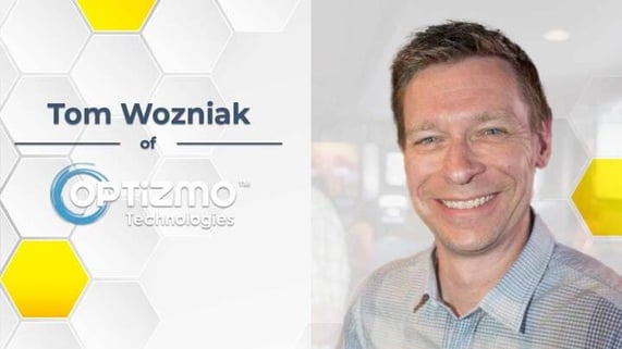 Photo of Tom Wozniak shown with Optizmo logo with yellow hexagon.