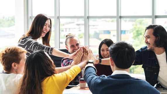 Group of people who found community via email meet in person.