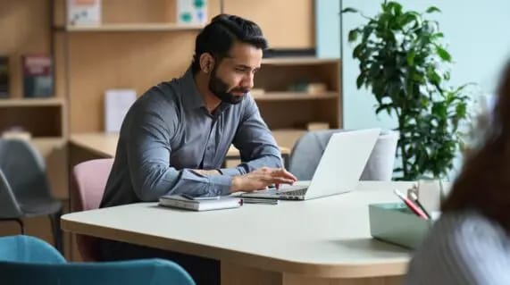 man working at laptop finding ways to aboid gmail bounces ahead of the great gmail purge